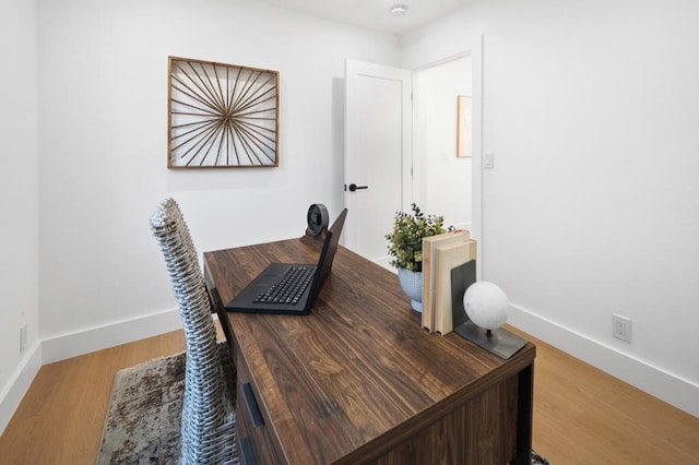 office area with hardwood / wood-style floors