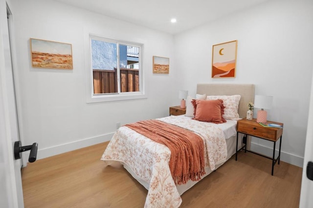 bedroom with light hardwood / wood-style floors