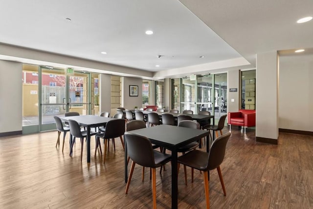 dining area featuring wood-type flooring and french doors