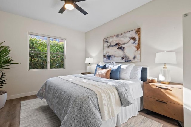 bedroom with hardwood / wood-style flooring and ceiling fan