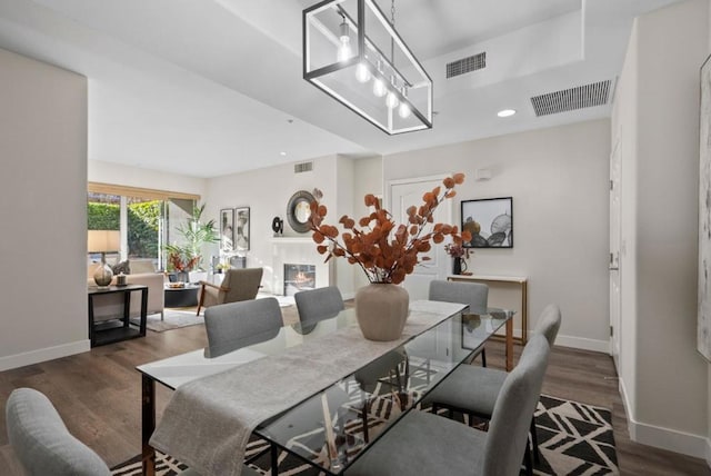 dining area featuring dark hardwood / wood-style floors