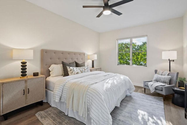 bedroom featuring dark hardwood / wood-style flooring and ceiling fan