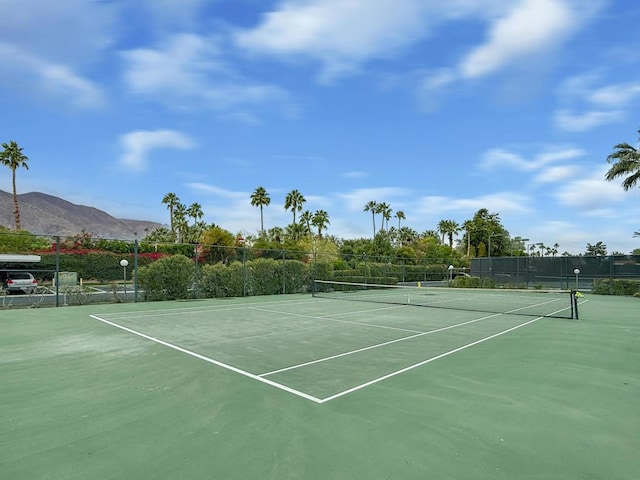 view of sport court with a mountain view