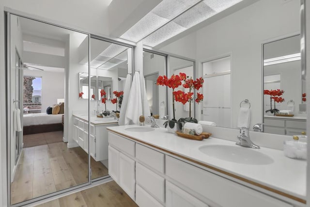 bathroom with vanity and hardwood / wood-style floors