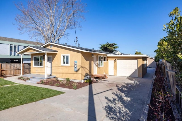 ranch-style home featuring a garage and a front yard