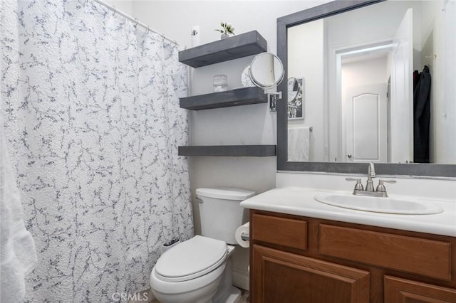 bathroom featuring vanity, toilet, and a shower with curtain