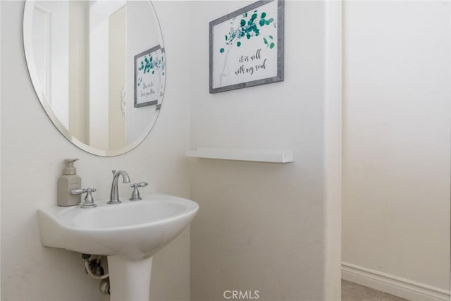 bathroom featuring baseboards