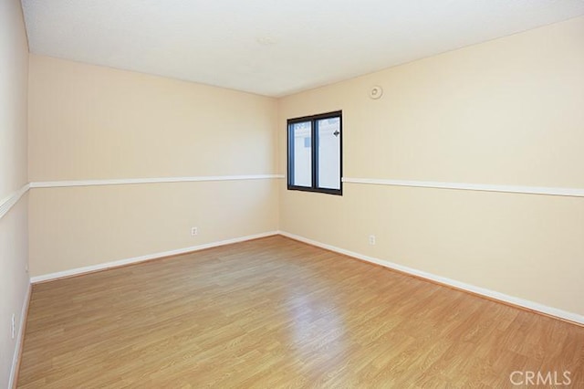 unfurnished room featuring light hardwood / wood-style flooring