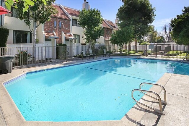 view of pool featuring a fenced in pool and fence
