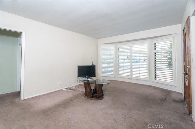 unfurnished living room featuring light colored carpet