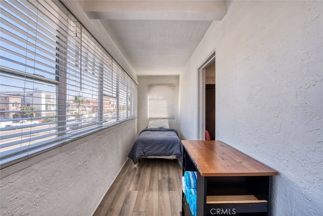 unfurnished bedroom with wood-type flooring