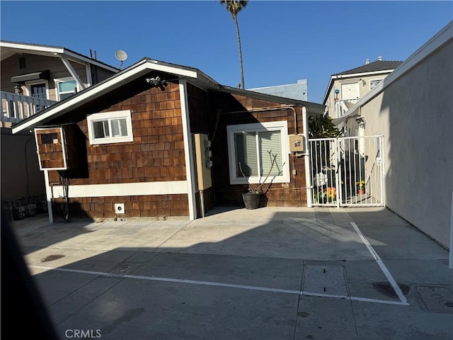 view of side of property featuring a patio area