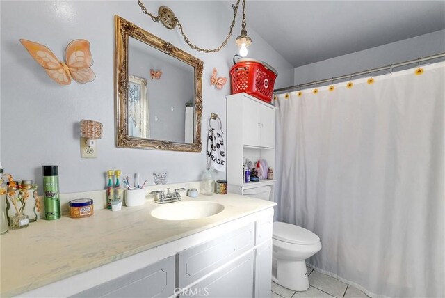 bathroom with vanity, tile patterned floors, and toilet