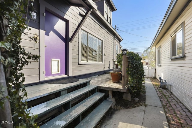 view of side of home with a deck