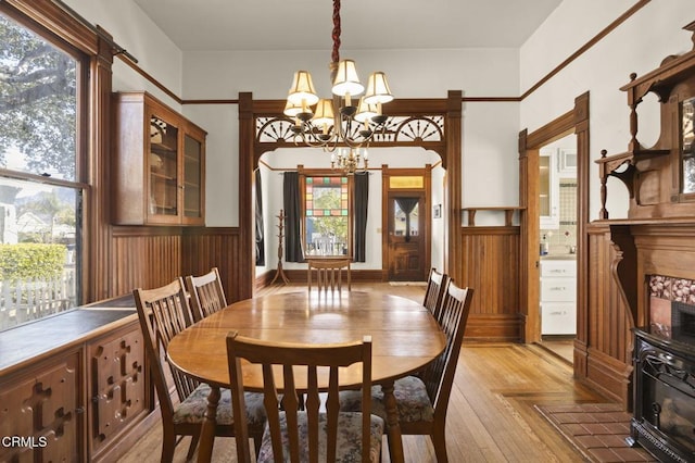 dining space featuring an inviting chandelier and light wood-type flooring