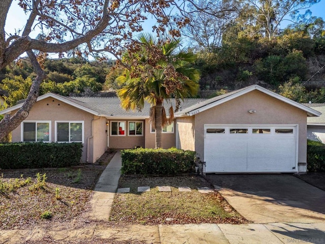 ranch-style home featuring a garage