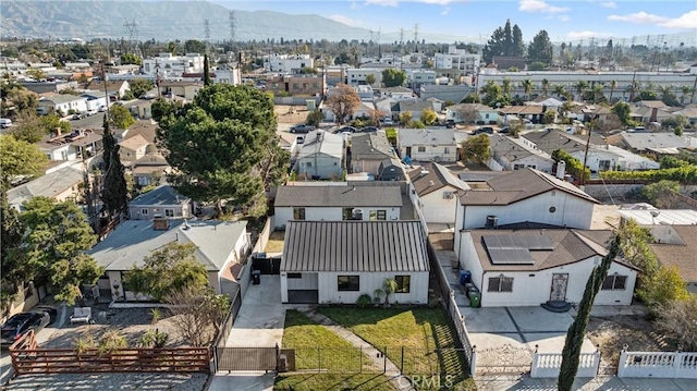 birds eye view of property with a mountain view