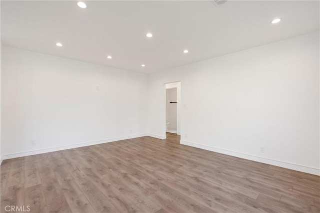 unfurnished room with light hardwood / wood-style flooring