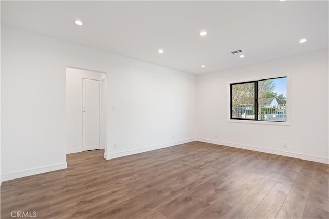 empty room featuring wood-type flooring