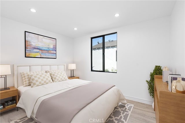 bedroom with light wood-type flooring