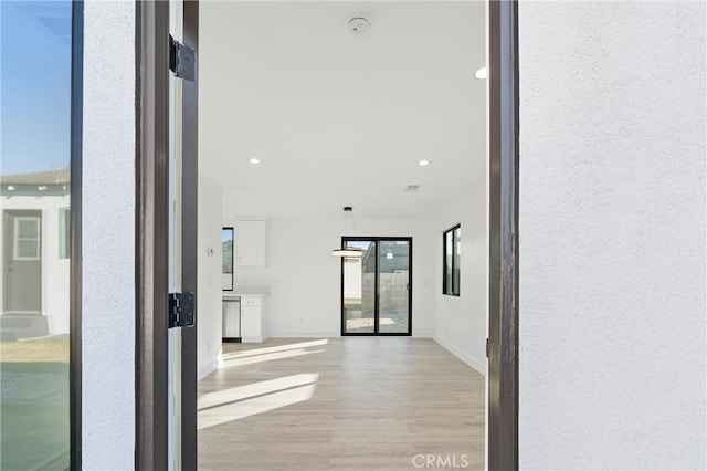 hallway featuring light hardwood / wood-style flooring