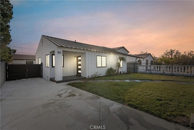 view of front of home with a lawn