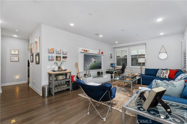 living room with dark hardwood / wood-style floors