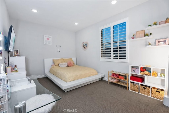 bedroom featuring dark colored carpet