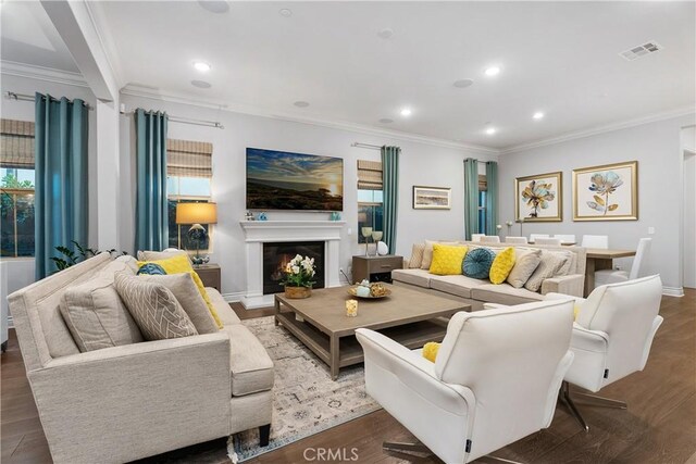 living room featuring crown molding and hardwood / wood-style flooring