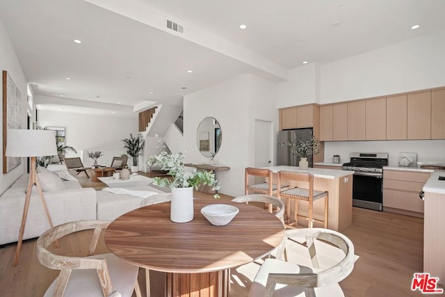 dining area featuring light wood-type flooring