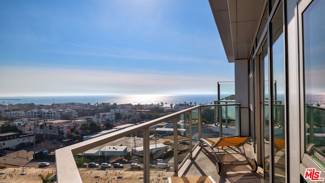 balcony featuring a water view