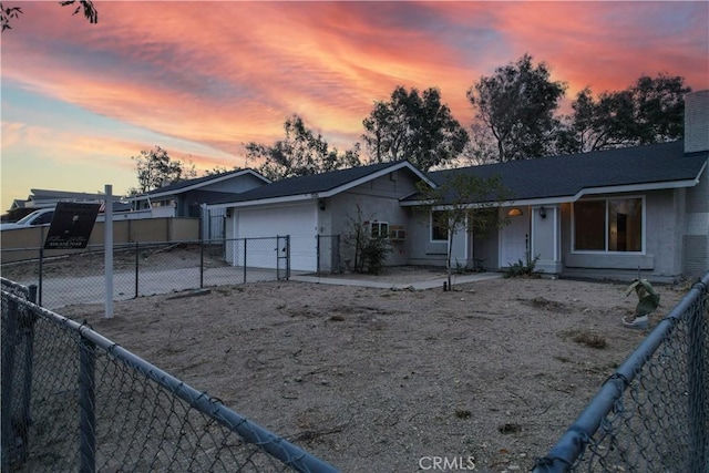 ranch-style house featuring a garage