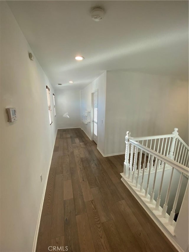 hallway featuring dark hardwood / wood-style flooring