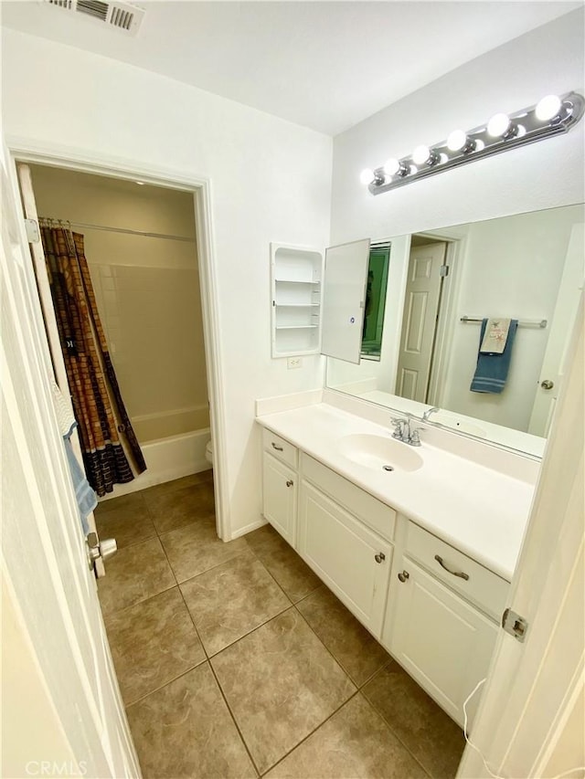 full bathroom featuring vanity, shower / tub combo, tile patterned flooring, and toilet