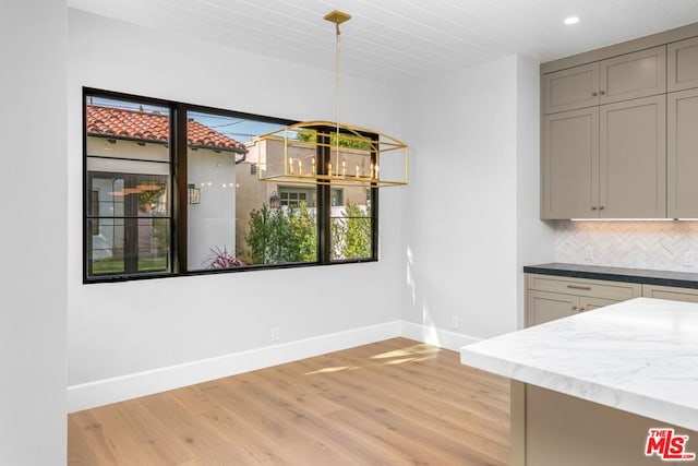 unfurnished dining area with light hardwood / wood-style floors