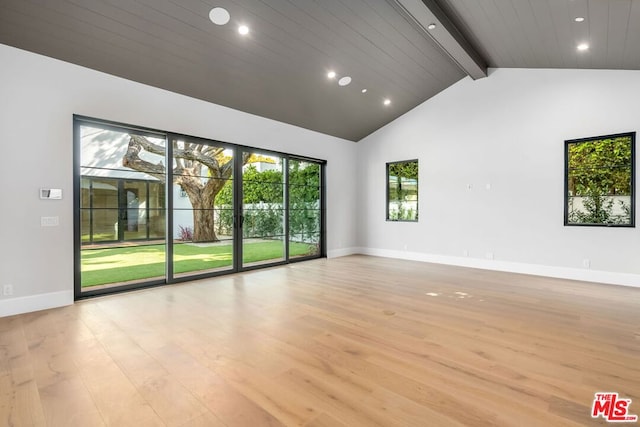 empty room featuring beam ceiling, light hardwood / wood-style flooring, high vaulted ceiling, and wooden ceiling