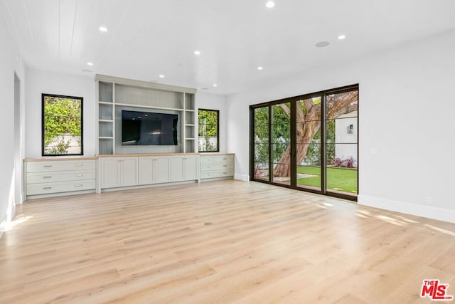 unfurnished living room with light hardwood / wood-style flooring