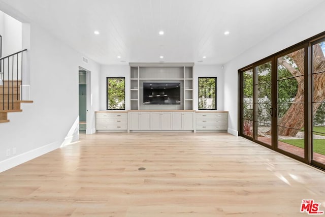 unfurnished living room featuring light hardwood / wood-style flooring