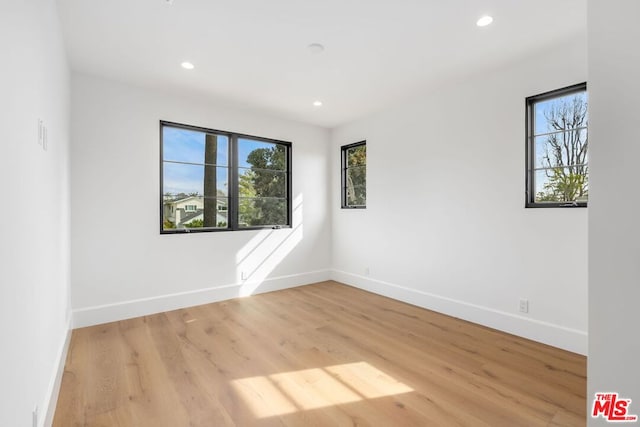 empty room with light hardwood / wood-style floors