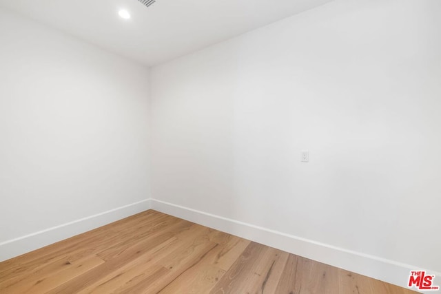 empty room featuring hardwood / wood-style flooring