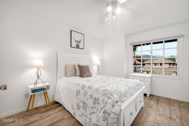 bedroom featuring light hardwood / wood-style flooring and ceiling fan