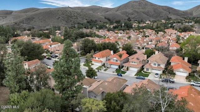 birds eye view of property featuring a mountain view