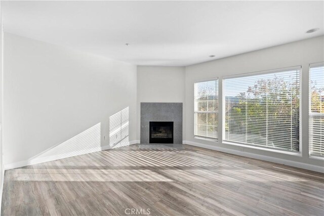 unfurnished living room featuring light hardwood / wood-style flooring