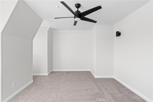 bonus room featuring ceiling fan, lofted ceiling, and light carpet