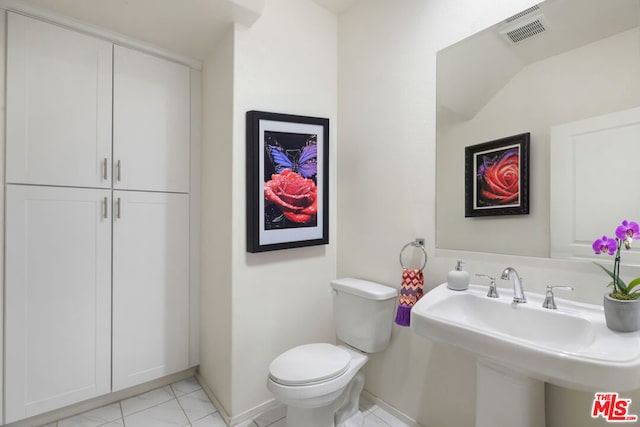 bathroom with toilet and sink