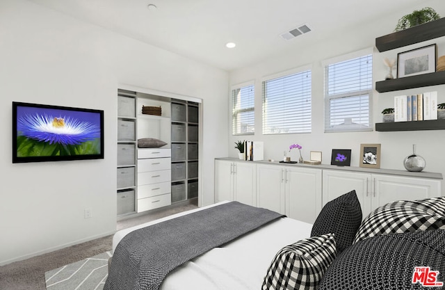 bedroom with light colored carpet