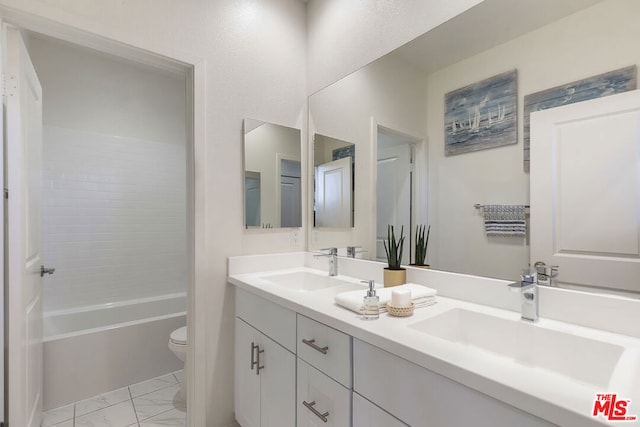 full bathroom with vanity,  shower combination, and toilet