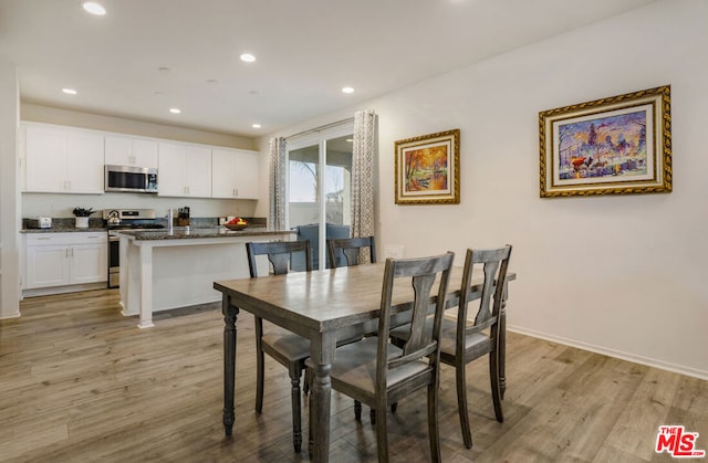 dining space featuring light hardwood / wood-style floors