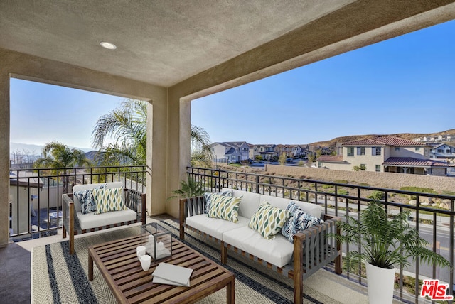 balcony with an outdoor hangout area