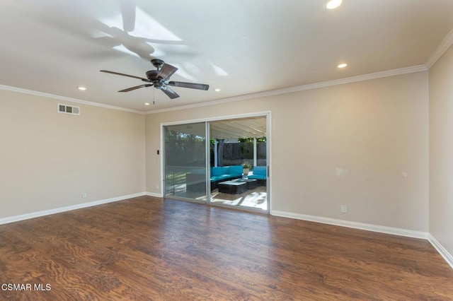 spare room with dark wood-type flooring, ornamental molding, and ceiling fan